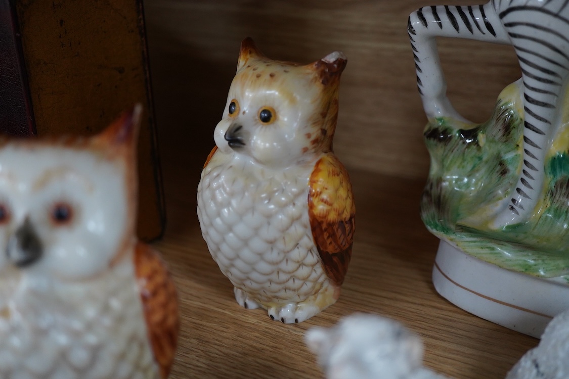 A pair of Worcester 'owl' candle snuffers, Staffordshire Zebra and two sheep, Belleek etc zebra 19cm wide.